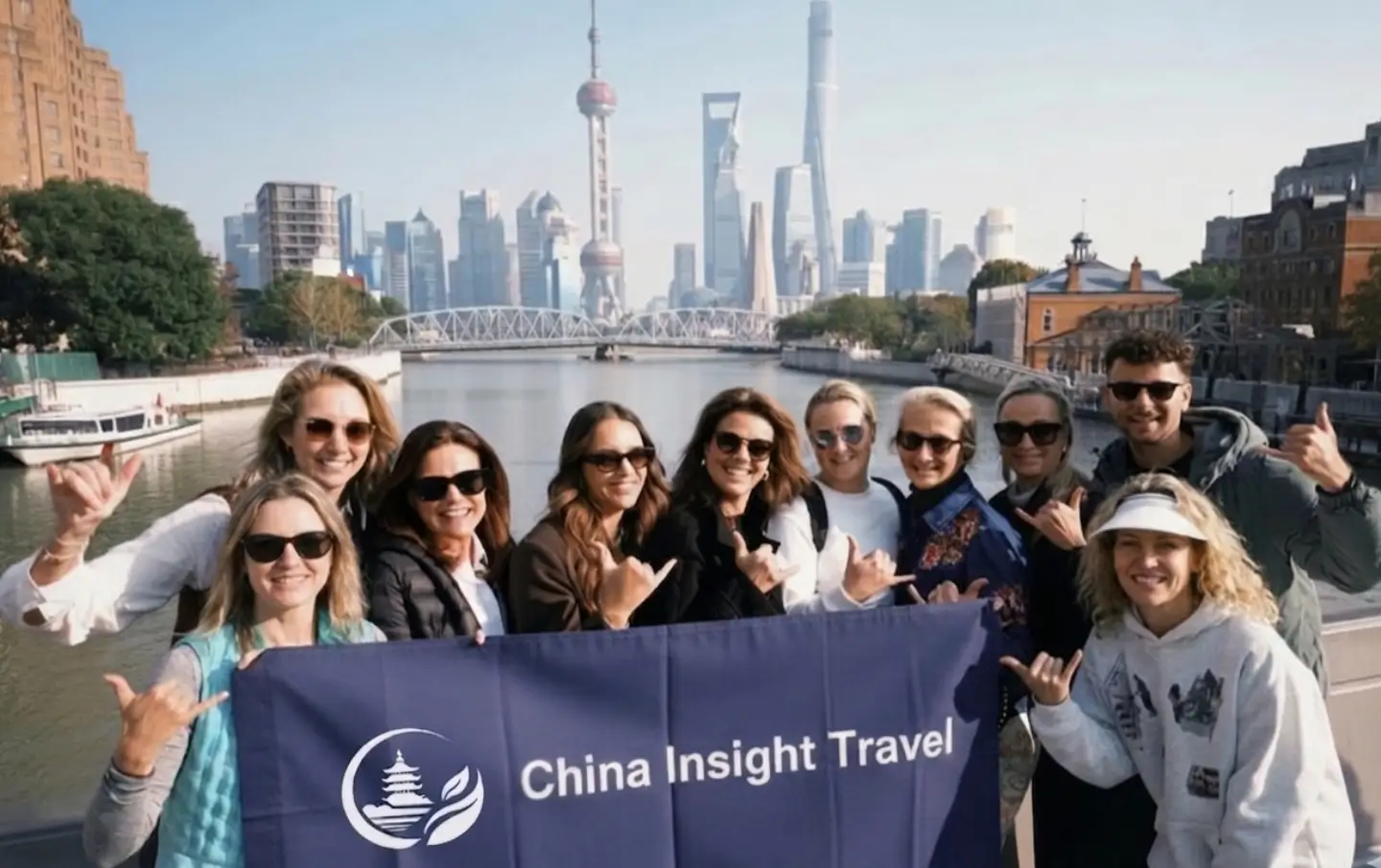 China Insight Travel team with international travelers in Shanghai city skyline background