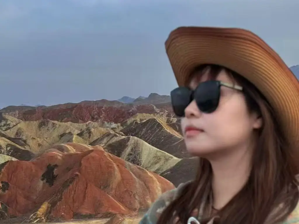 Mia Chen private tour guide in China with scenic mountain landscape