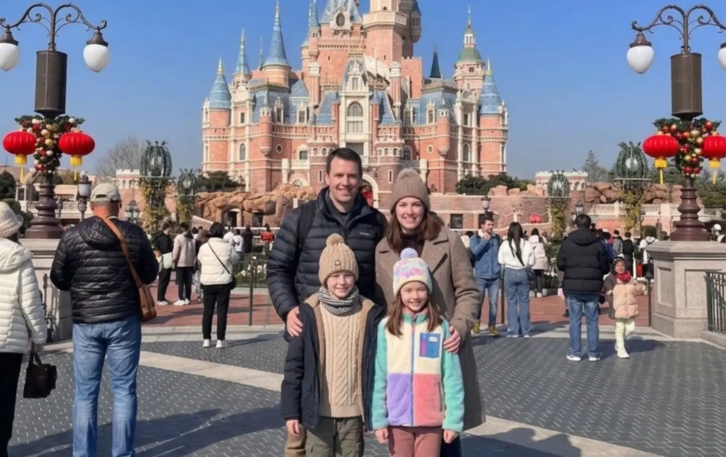 family with children at Shanghai Disneyland castle China family tours experience