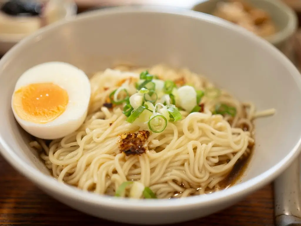 Shanghai noodles with soy-based sauce and egg, traditional local cuisine