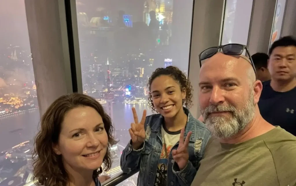 Tourists enjoying night view from Shanghai observation deck