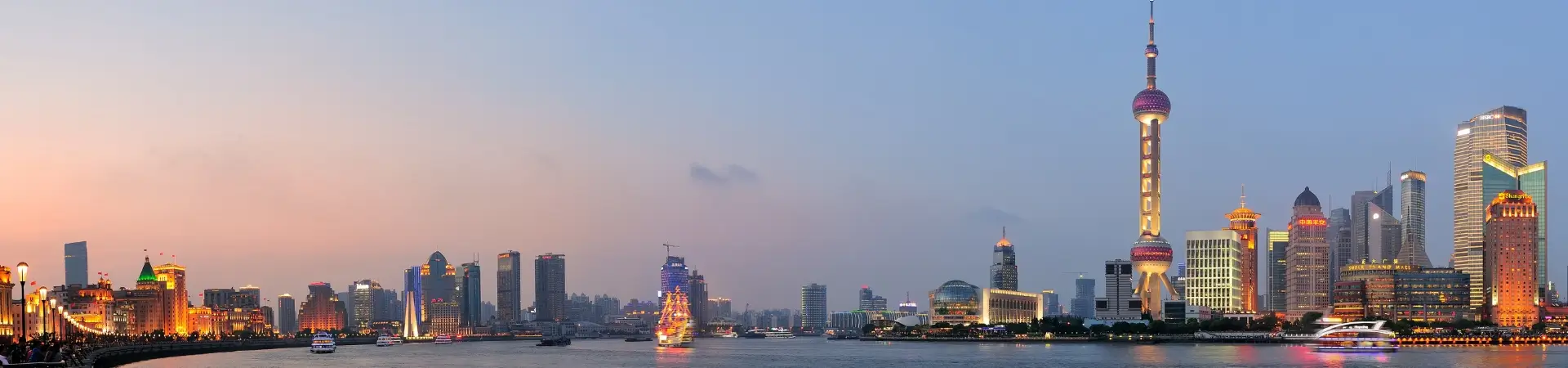 Shanghai skyline at dusk featuring the Bund waterfront and Lujiazui financial district