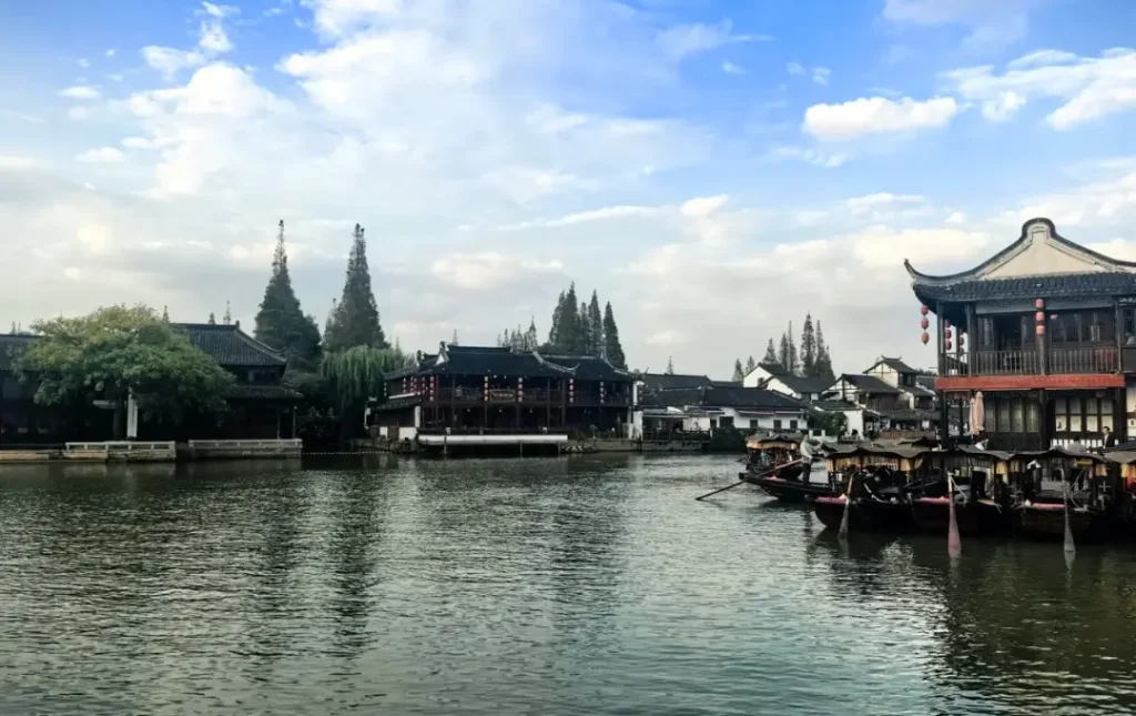 traditional chinese water town with canals wooden boats and historic houses
