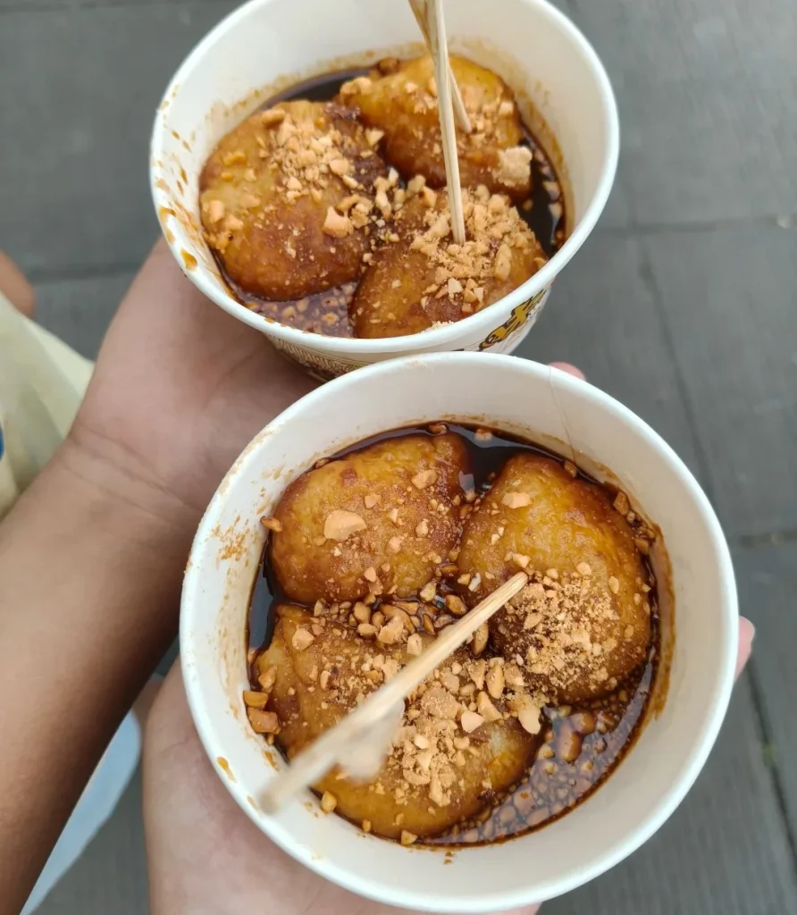 KBChengdu san da pao fried glutinous rice balls with brown sugar sauce and crushed peanuts, a classic street snack