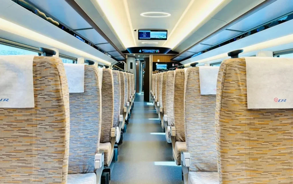 high-speed-rail-standard-class-cabin-interior Fuxing high speed train standard class cabin interior with clean spacious seats and modern lighting