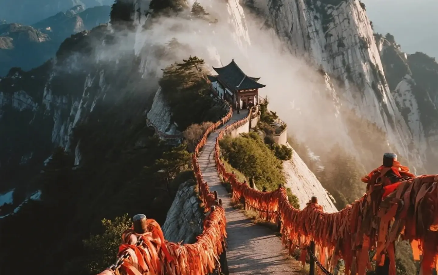 South Peak temple and red ribbon-lined cliffside path on Mount Huashan, guided Mount Huashan tours