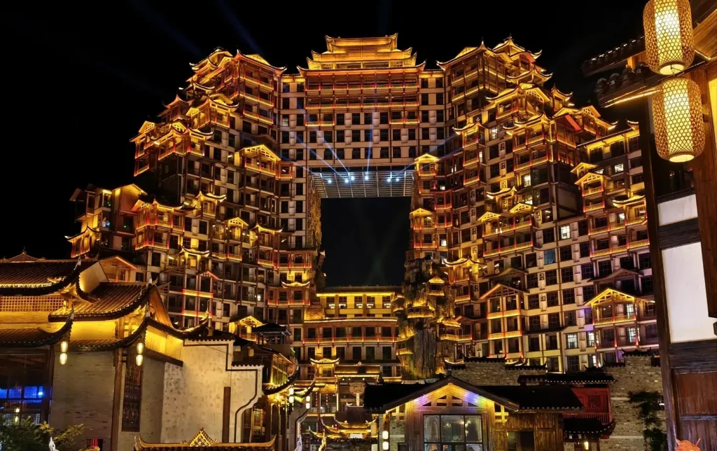 Dayong Ancient City's 72 Qilou building lit up at night, a Zhangjiajie cultural tour highlight