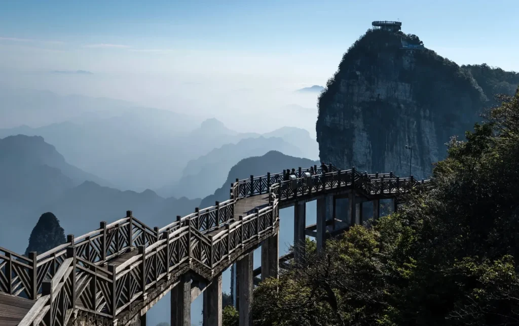 Sunrise view of Tianmen Mountain's glass skywalk, a scenic highlight on private tours
