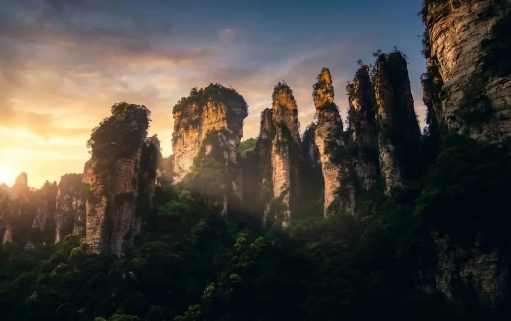 Golden sunset silhouette of Zhangjiajie's stone pillars on a private landscape tour